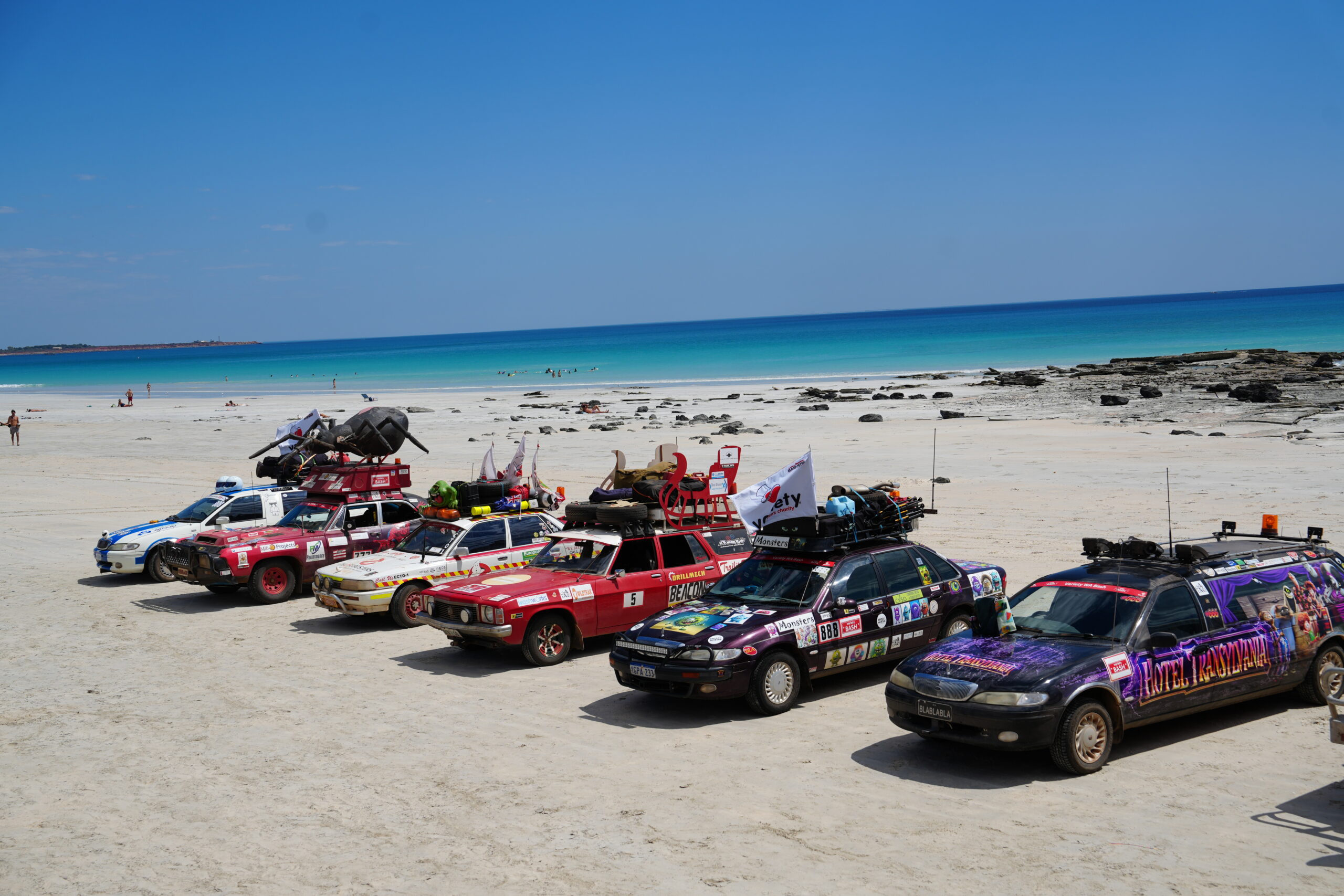 Variety Bash cars gathered on a Western Australian beach
